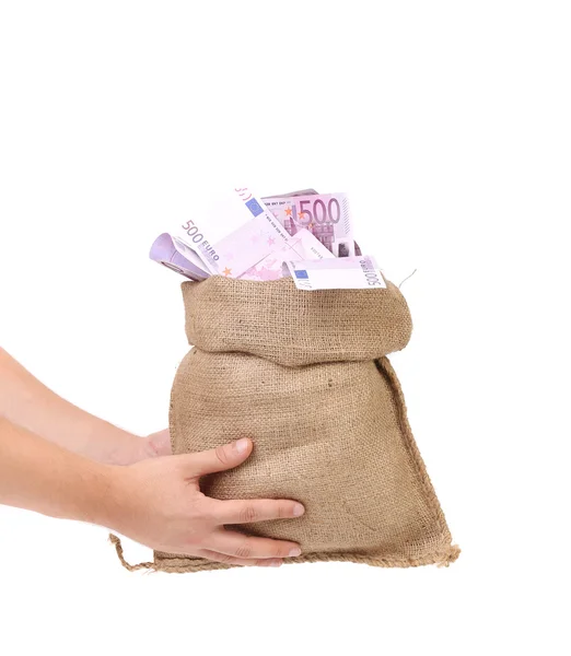 Hands holding bag full with euro bills — Stock Photo, Image