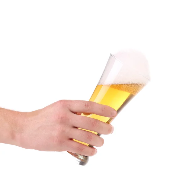 Glass of beer with foam in hand — Stock Photo, Image