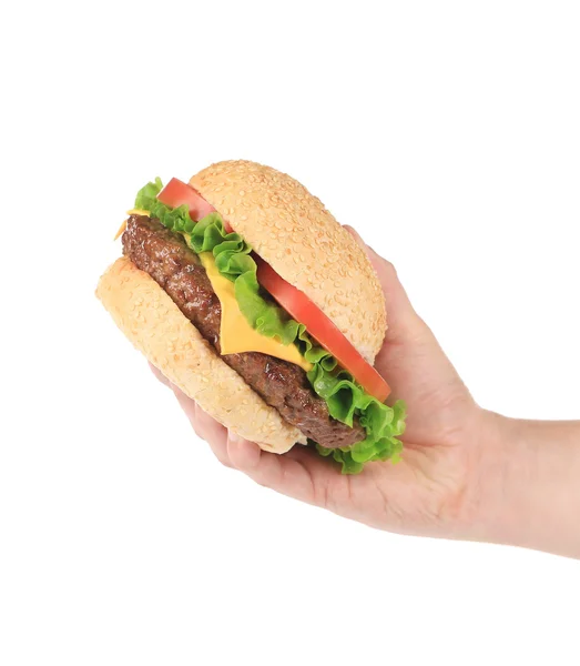 Hand houdt verse hamburger — Stockfoto