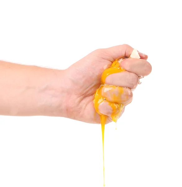 Hand smash egg yolk — Stock Photo, Image