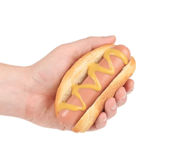 Hotdog con mostaza en la mano — Foto de Stock