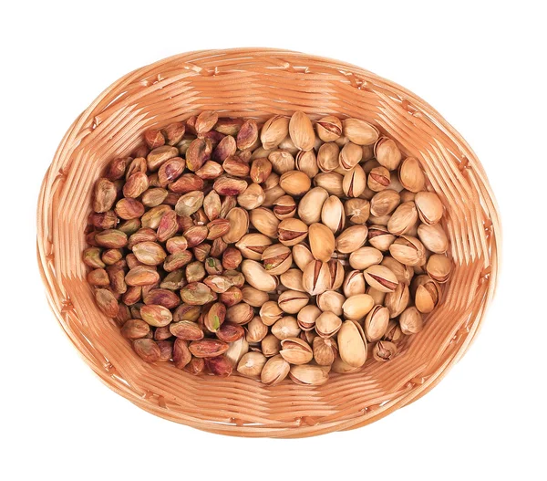 Wicker basket with pistachios — Stock Photo, Image