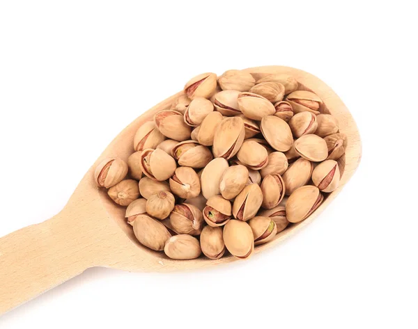 Wooden spoon with pistachios — Stock Photo, Image