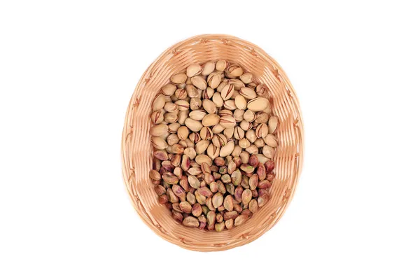 Wicker basket with pistachios — Stock Photo, Image