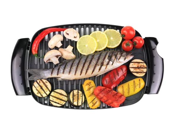 Seabass on grill with vegetables — Stock Photo, Image
