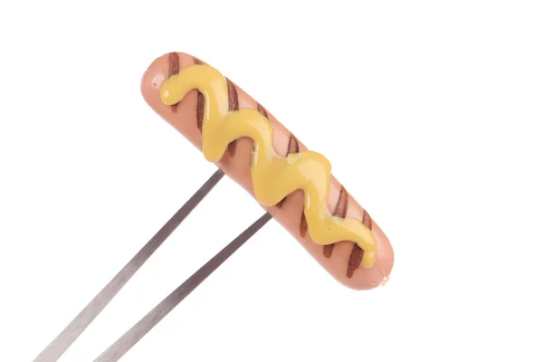 Sausage mustard prick with a fork — Stock Photo, Image