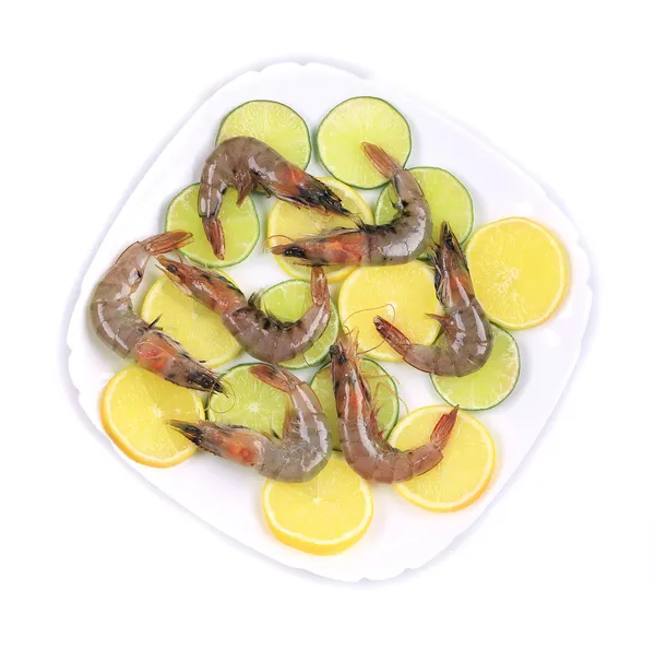 Raw shrimps on plate — Stock Photo, Image