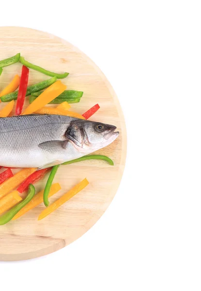 Seabass fish on colorful pepper — Stock Photo, Image