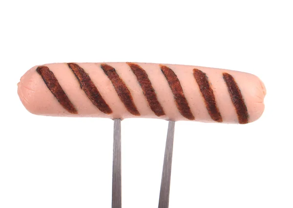 Grilled sausage on a fork — Stock Photo, Image