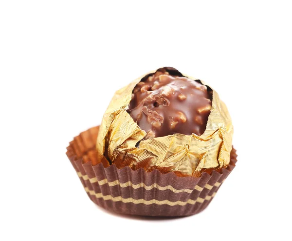 Chocolate gold bonbon with nuts. — Stock Photo, Image