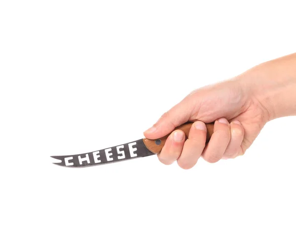 Hand holds cheese knife. — Stock Photo, Image