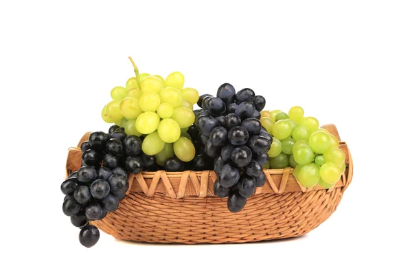 Black and green grapes in basket. — Stock Photo, Image