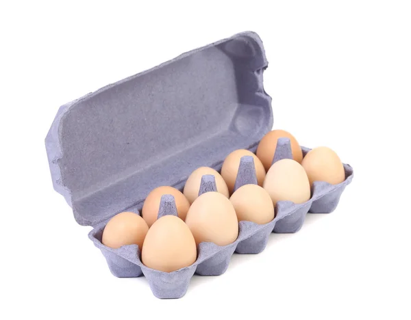 Egg box with ten brown eggs — Stock Photo, Image