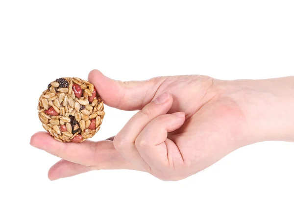 Honey bar with sunflower seed in hand — Stock Photo, Image