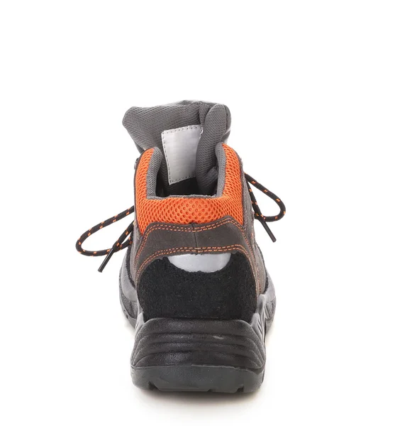 Черный ботинок с оранжевой вставкой . — стоковое фото