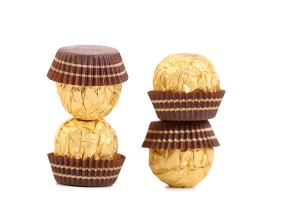 Two stacks of chocolate bonbons. — Stock Photo, Image