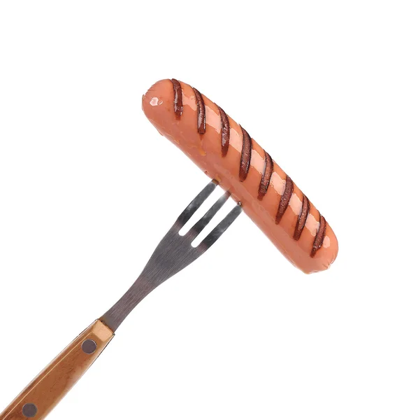 Grilled sausage on a fork. — Stock Photo, Image