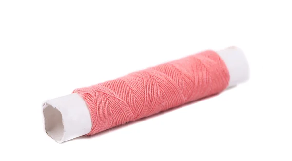 Reel with pink thread. — Stock Photo, Image