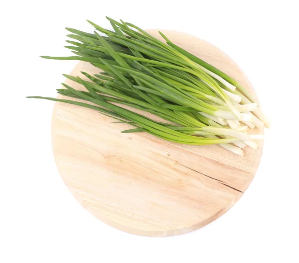 Green onion on wooden platter — Stock Photo, Image