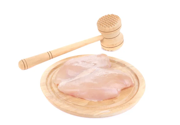 Raw chicken breast and meat mallet — Stock Photo, Image