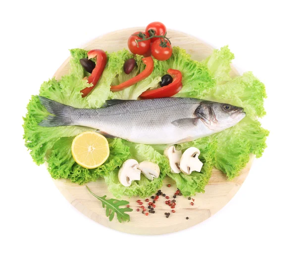 Fresh seabass on platter with lettuce — Stock Photo, Image