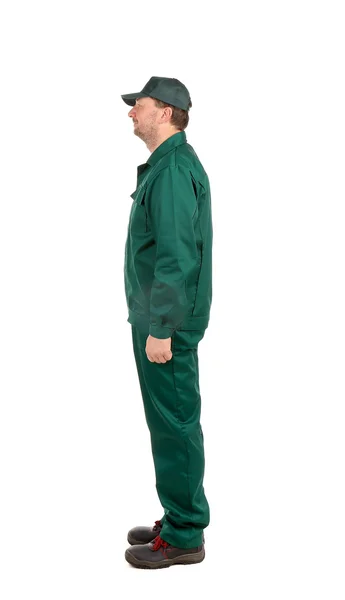 Чоловік в зеленому робочому одязі — стокове фото