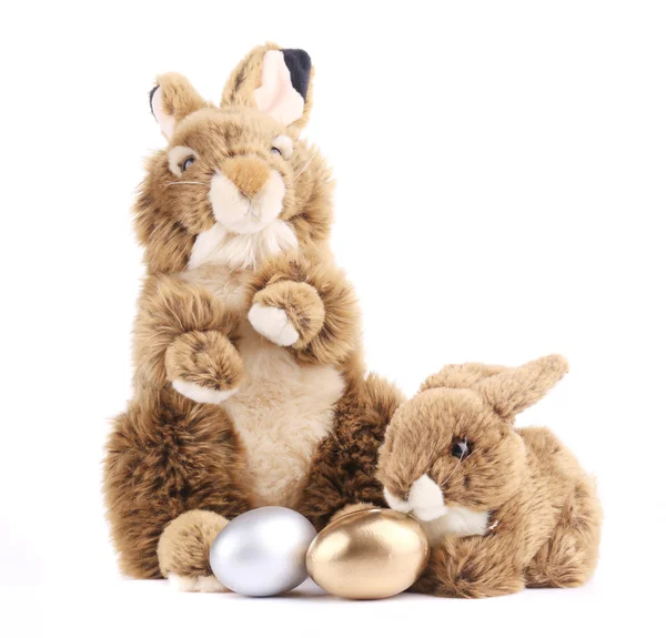 Toy rabbits with easter eggs. — Stock Photo, Image