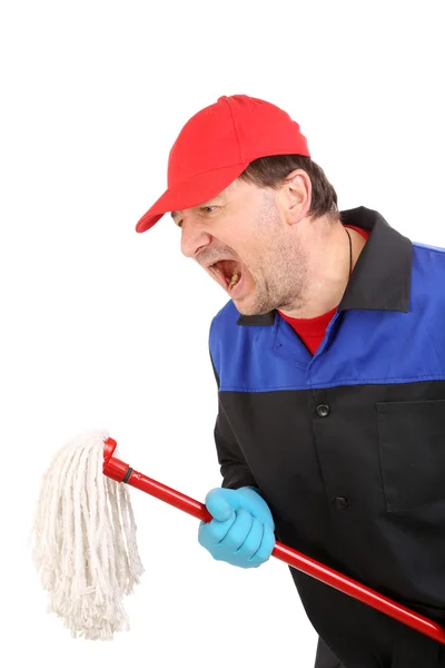 Homem irritado em roupas de trabalho com esfregona — Fotografia de Stock