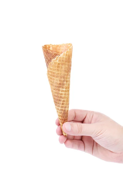 Hand holds empty ice cream corn — Stock Photo, Image
