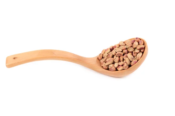 Wooden spoon with pistachios — Stock Photo, Image