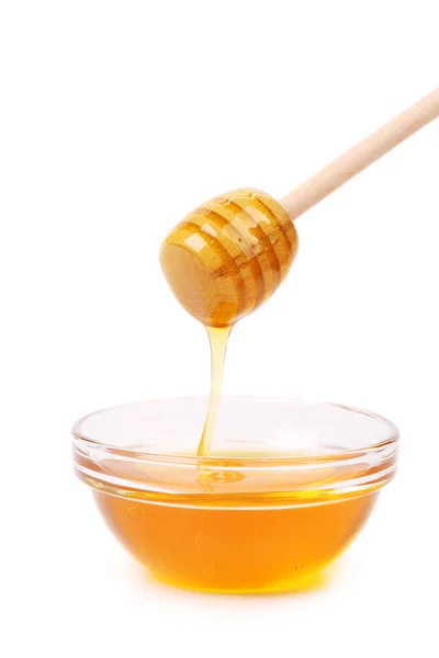 蜂蜜从木制传送器上滴下 — 图库照片