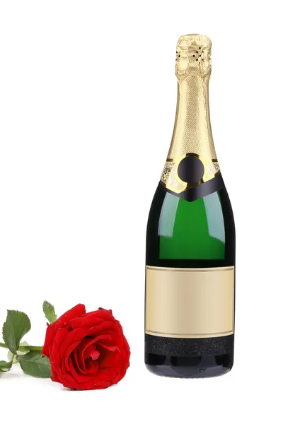 Champagne bottle and red rose. — Stock Photo, Image