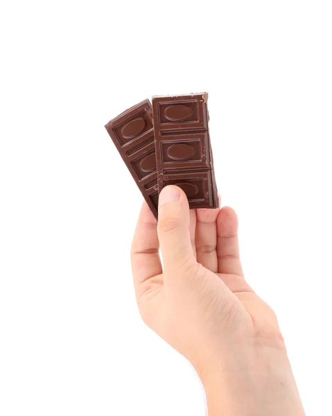 Hand houdt donkere chocolade. — Stockfoto