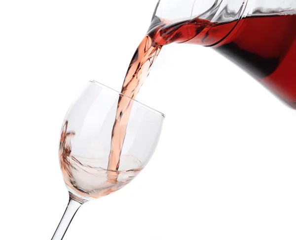 Rose wine pouring from glass jar. — Stock Photo, Image