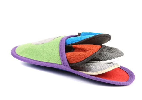 Colourful slippers into big slipper. — Stock Photo, Image