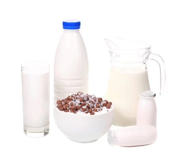 Milk products and bowl with chocolate cereals. — Stock Photo, Image