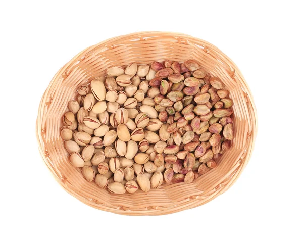 Wicker basket with pistachios. — Stock Photo, Image