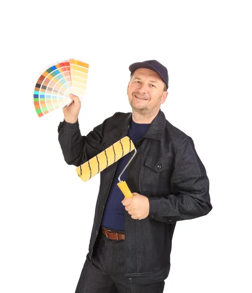 Worker with color samples and roller. — Stock Photo, Image