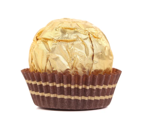 Sweet chocolate candy wrapped in golden foil. — Stock Photo, Image