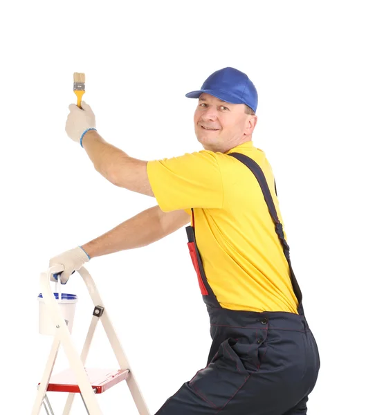 Worker on ladder with paintbrush. — Stock Photo, Image