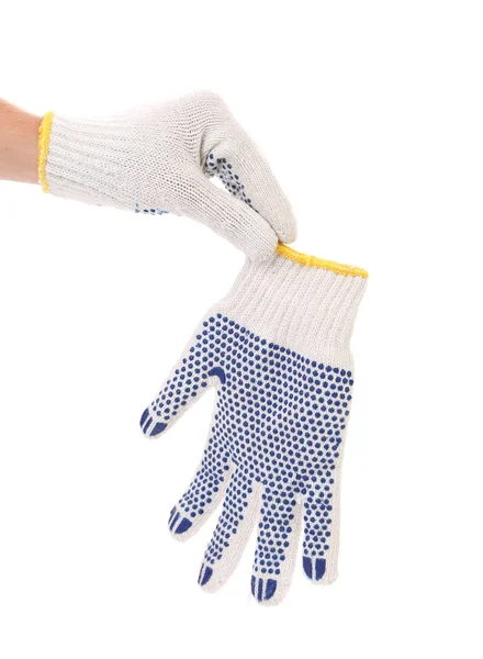 Hand holds protective gloves with blue circles. — Stock Photo, Image