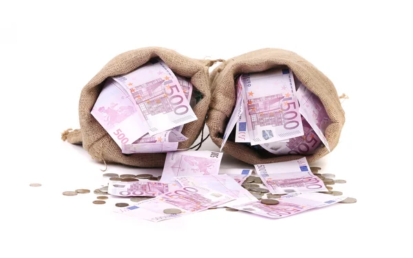 Bags with euro banknotes and coins. — Stock Photo, Image