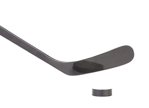 Black ice hockey stick and puck. — Stock Photo, Image