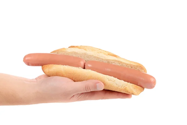 Hand holds hotdog with two sausages. — Stock Photo, Image