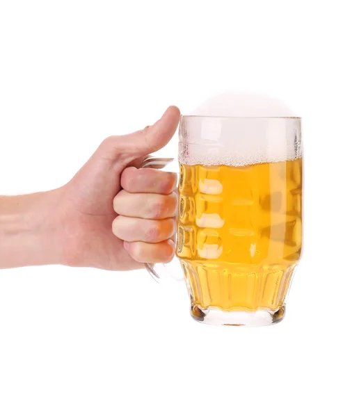 Male hand holding up a glass of beer. — Stock Photo, Image