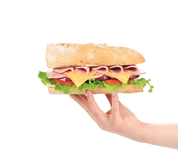 Hand met stokbrood sandwich. — Stockfoto