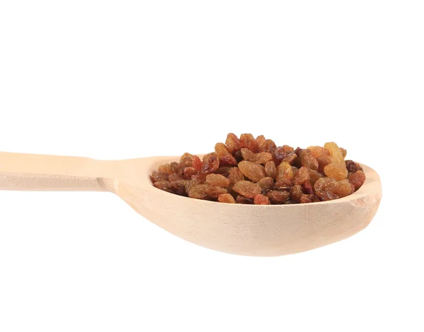 Wooden spoon with raisins. — Stockfoto