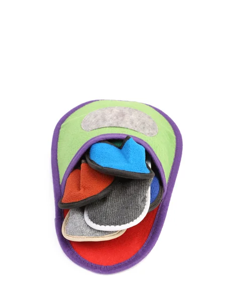 Colourful slippers into big slipper. — Stock Photo, Image