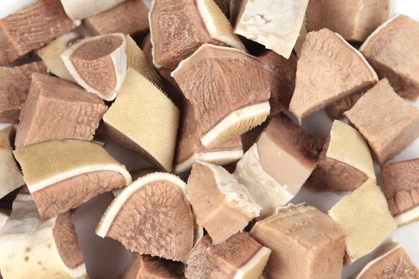 Small pieces of chopped cow tongue close up. — Stock Photo, Image