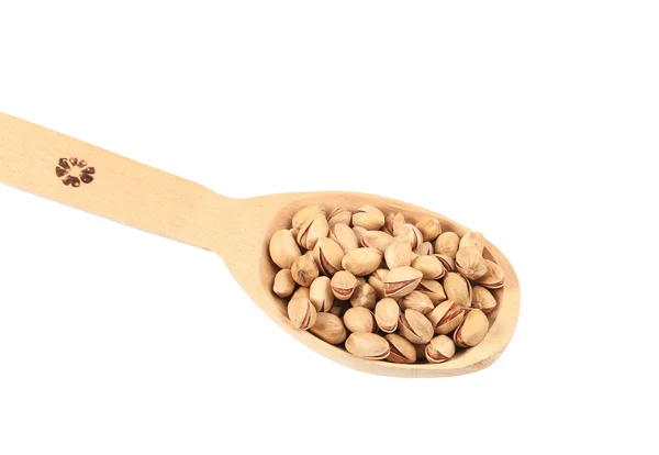 Wooden spoon with pistachios. — Stock Photo, Image